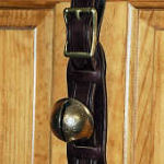 Display strap with 7 antique petal bells and tie ring