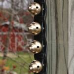 Display strap with 20 modern acorn bells