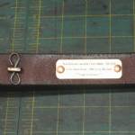 Unlined strap with nameplate